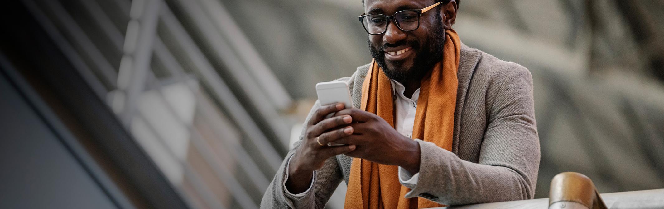 Young man holding cell phone